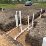 a construction site with white pipes.